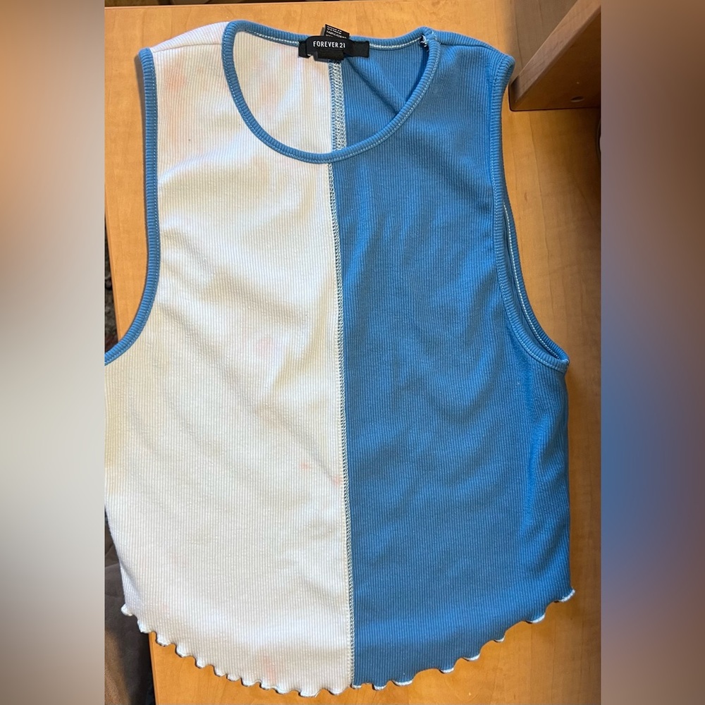 Used blue tank top with lettuce cut end